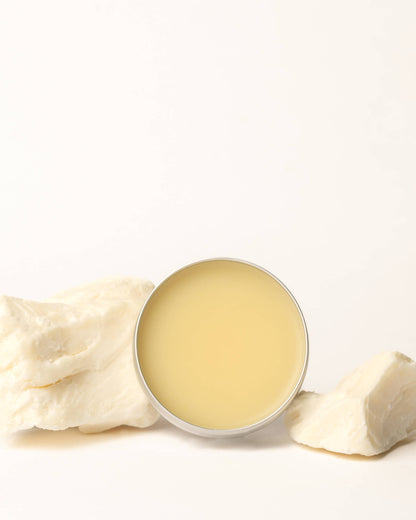 Balm in a round container with a white background